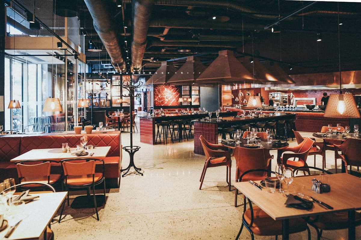 Small restaurant with warm lighting and outdoor seating